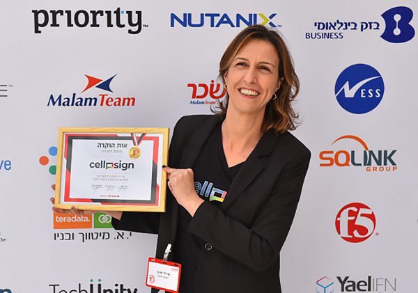 A Cellosign representative holding the IT Awards certificate